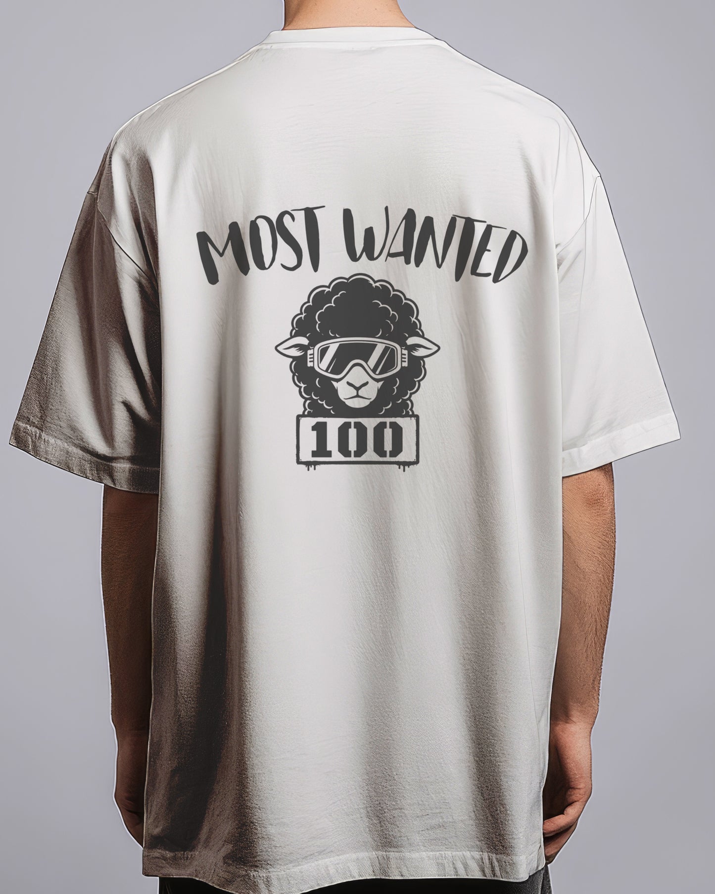 T-shirt with 'Most Wanted 100' graphic on the back, worn by a person against a gray background