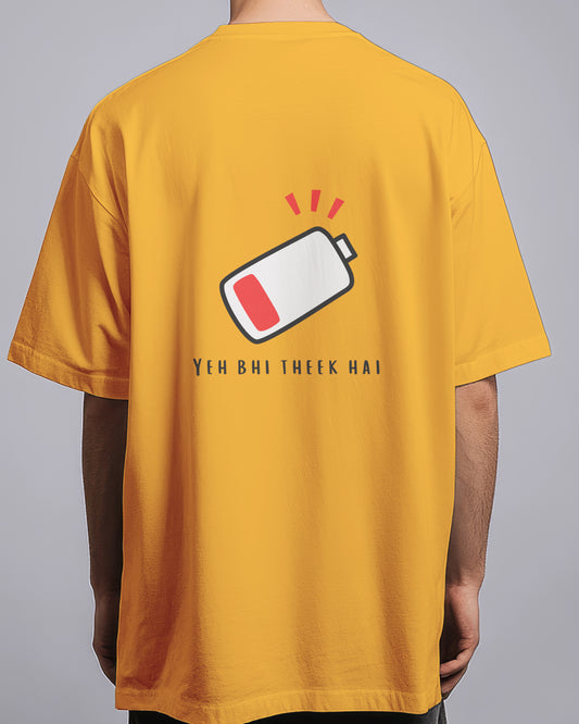 Yellow t-shirt with a battery icon and text on the back, worn by a person.